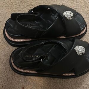 Kurt Geiger Black Sandals with Elegant Medallion